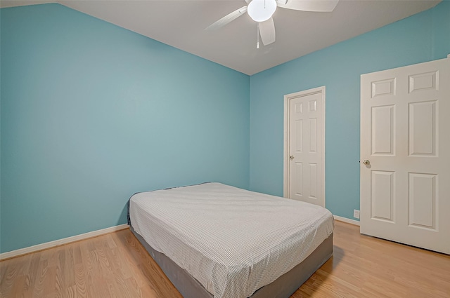 bedroom with ceiling fan and light hardwood / wood-style floors