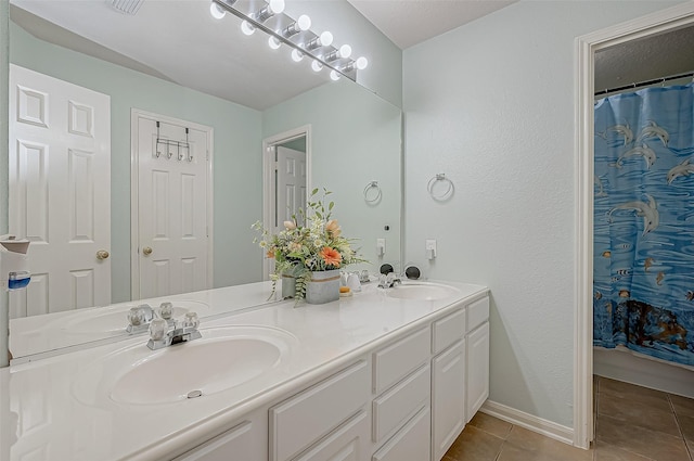 bathroom with vanity and tile patterned floors