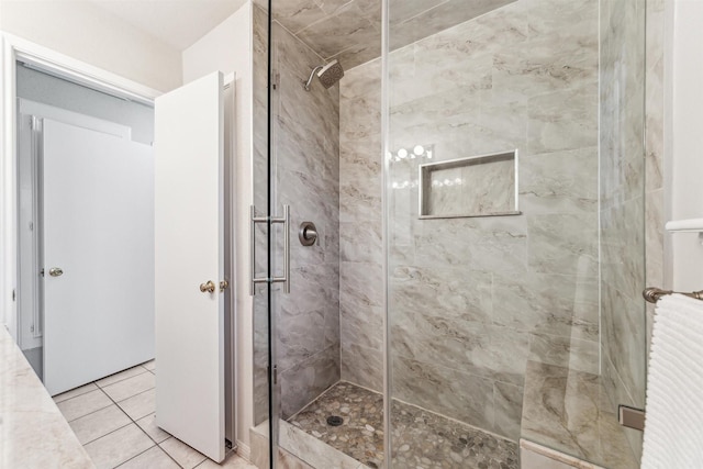 bathroom featuring tile patterned floors and walk in shower