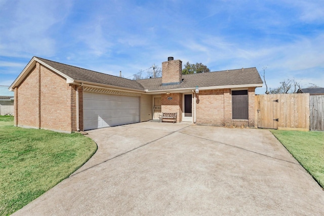 ranch-style home with a garage and a front yard