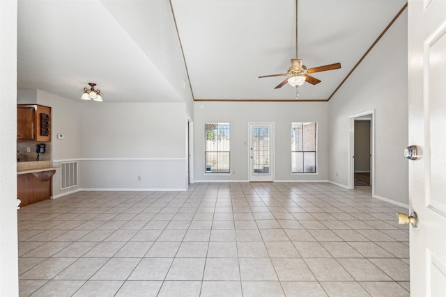 unfurnished living room featuring light tile patterned flooring, ceiling fan, lofted ceiling, and crown molding