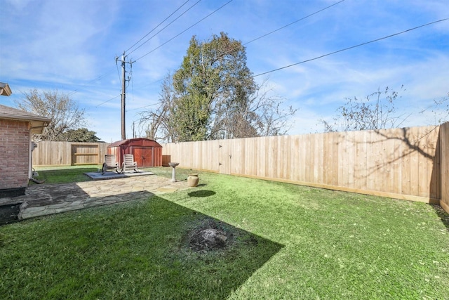 view of yard featuring a patio and a shed