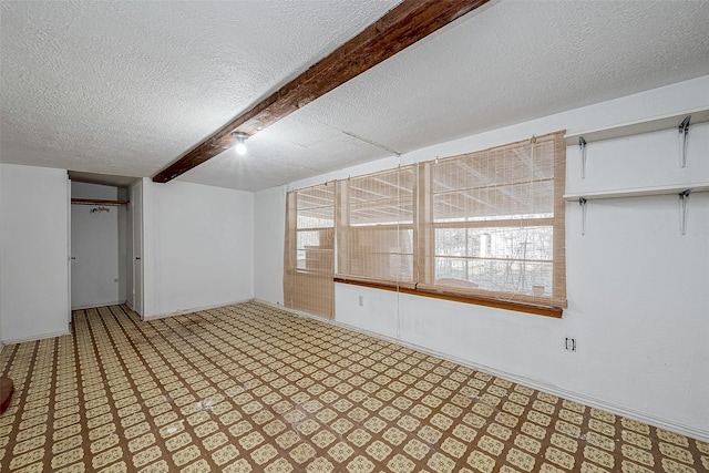 basement featuring a textured ceiling