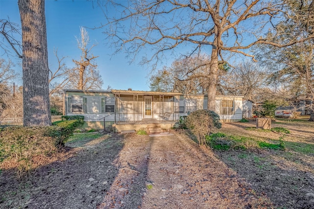 ranch-style home with a porch