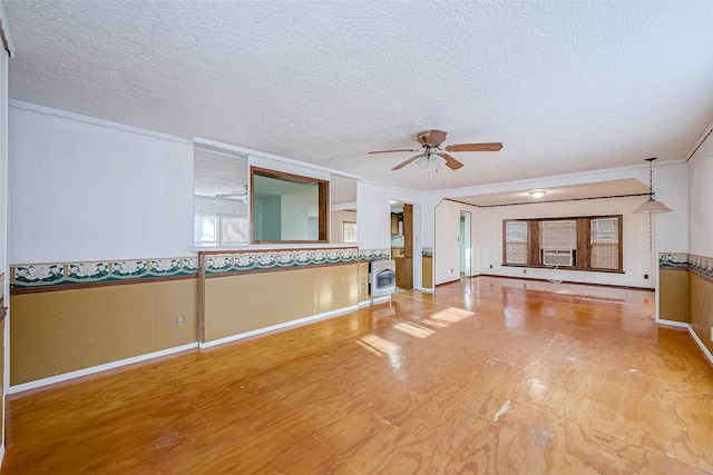 unfurnished living room featuring heating unit, a textured ceiling, ceiling fan, and cooling unit