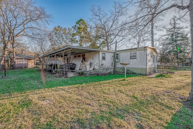 rear view of property with a lawn