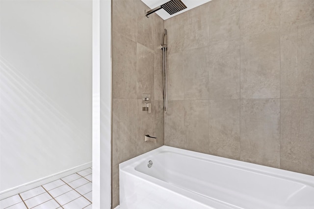 full bath featuring tile patterned flooring, baseboards, and shower / bathtub combination