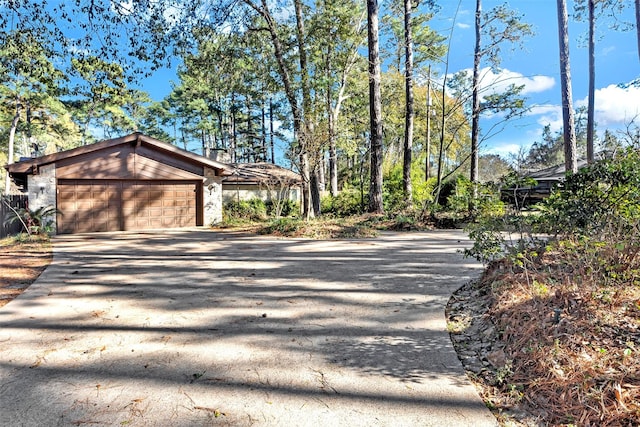 exterior space featuring a garage and concrete driveway