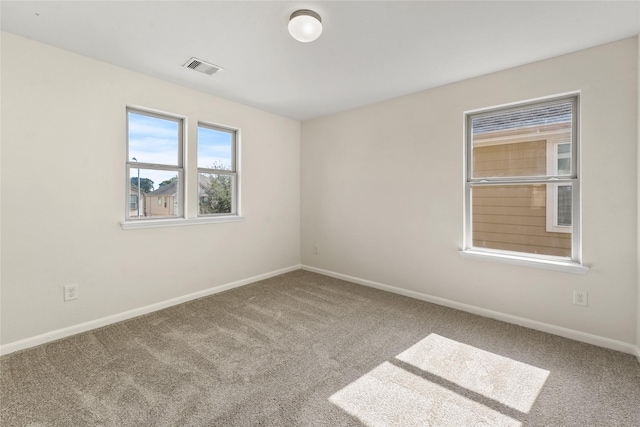 spare room featuring carpet flooring