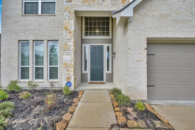 entrance to property featuring a garage