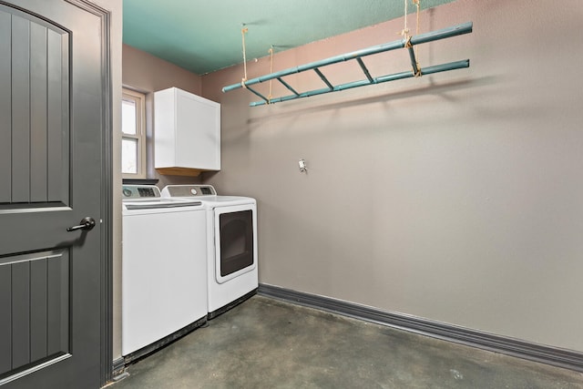 clothes washing area with washer and dryer