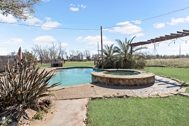 view of swimming pool featuring a lawn and an in ground hot tub