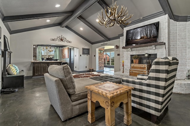 living room featuring a notable chandelier, beam ceiling, a fireplace, and high vaulted ceiling