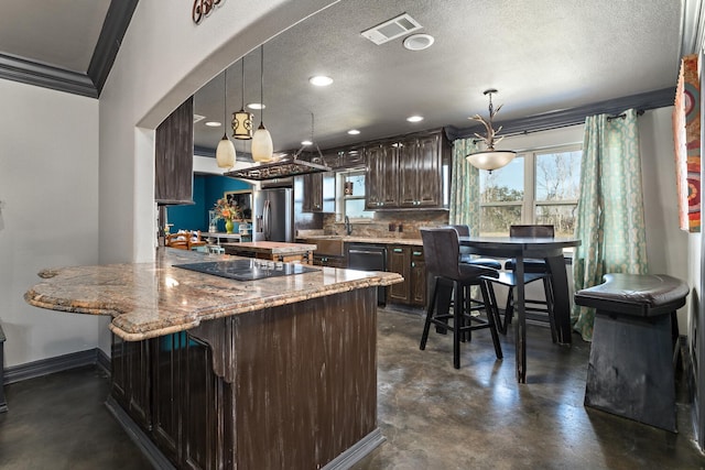 kitchen with dark brown cabinetry, hanging light fixtures, ornamental molding, kitchen peninsula, and black appliances