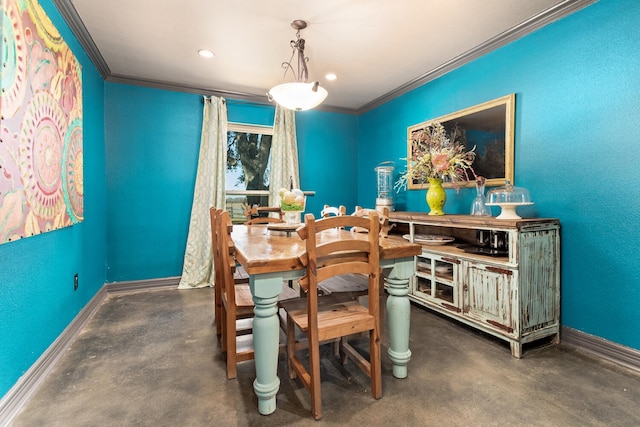 dining space featuring crown molding