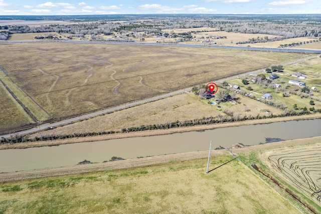 drone / aerial view featuring a rural view and a water view