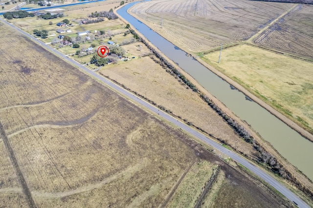 aerial view with a rural view and a water view