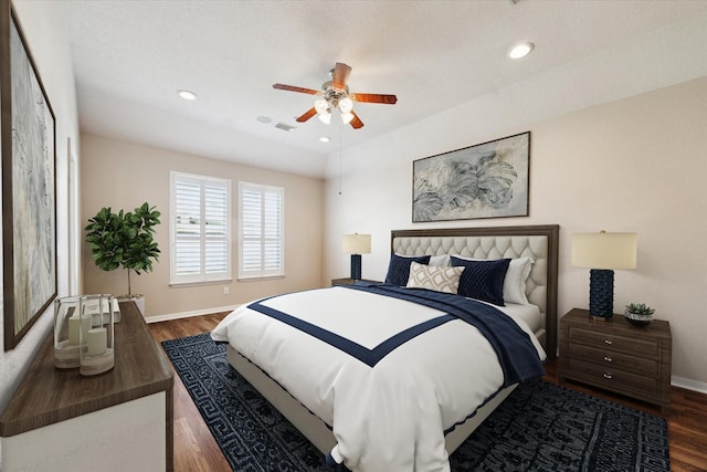 bedroom featuring recessed lighting, visible vents, a ceiling fan, wood finished floors, and baseboards