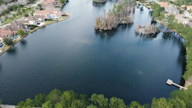 drone / aerial view with a residential view and a water view