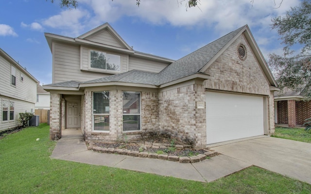 view of front of property featuring cooling unit, a garage, and a front yard