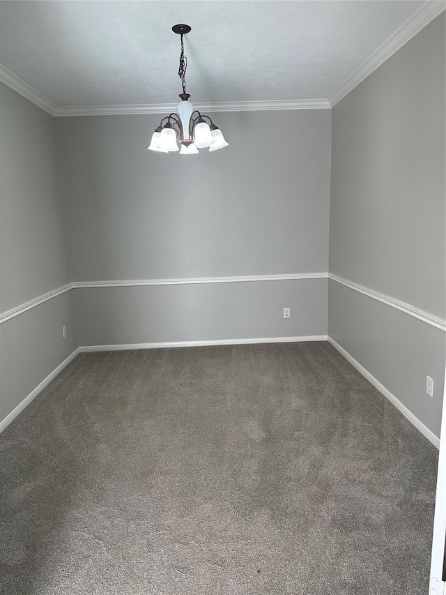 carpeted spare room with crown molding and a notable chandelier