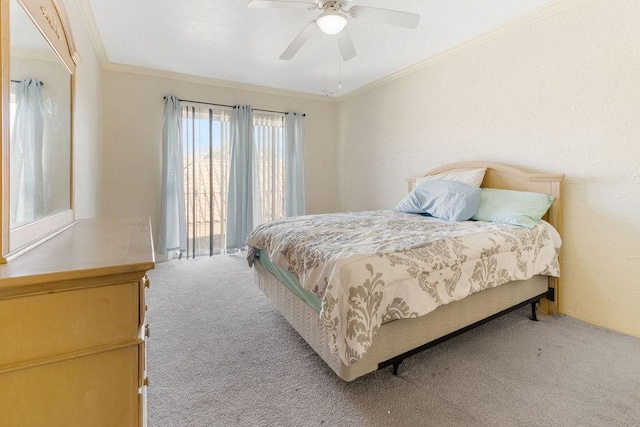 carpeted bedroom featuring crown molding and ceiling fan