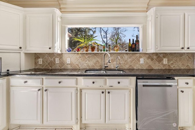 kitchen featuring sink, white cabinetry, tasteful backsplash, dishwasher, and dark stone counters