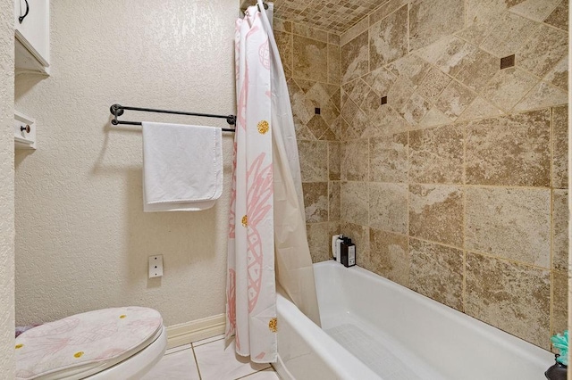 bathroom with tile patterned flooring, shower / tub combo, and toilet