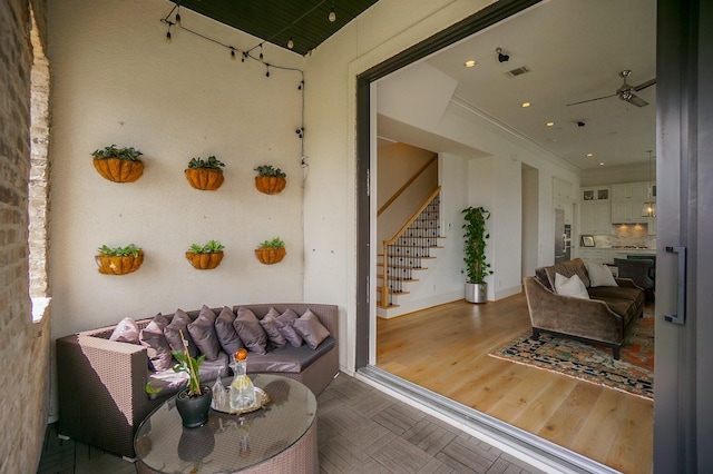 interior space featuring ceiling fan and outdoor lounge area