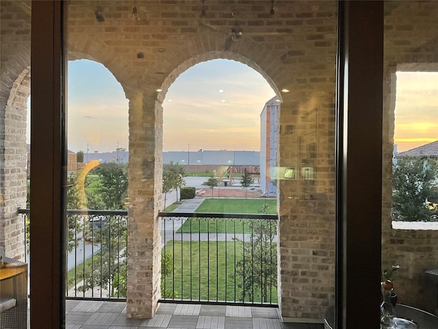 view of balcony at dusk