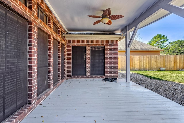 wooden terrace featuring ceiling fan