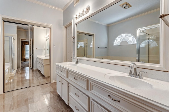 bathroom with vanity, crown molding, and a shower with door