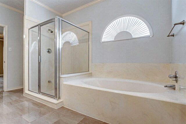 bathroom with shower with separate bathtub and crown molding