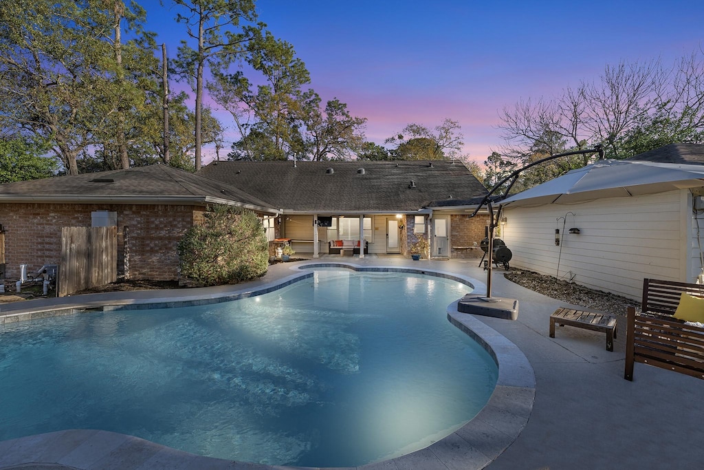 view of pool with a patio area and a fenced in pool