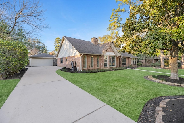 view of front of home featuring a garage, a front yard, brick siding, and a chimney