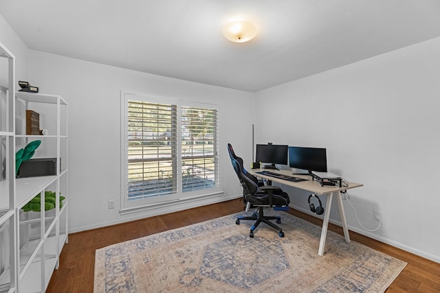 office area featuring baseboards and wood finished floors