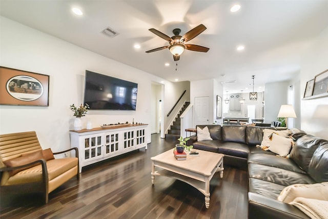 living room featuring visible vents, dark wood-type flooring, ceiling fan, stairway, and recessed lighting