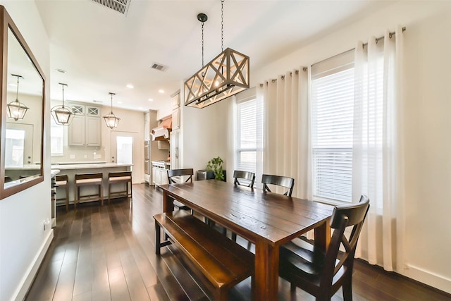 dining room featuring recessed lighting, dark wood-style floors, and visible vents
