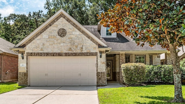 view of front of home featuring a garage and a front lawn