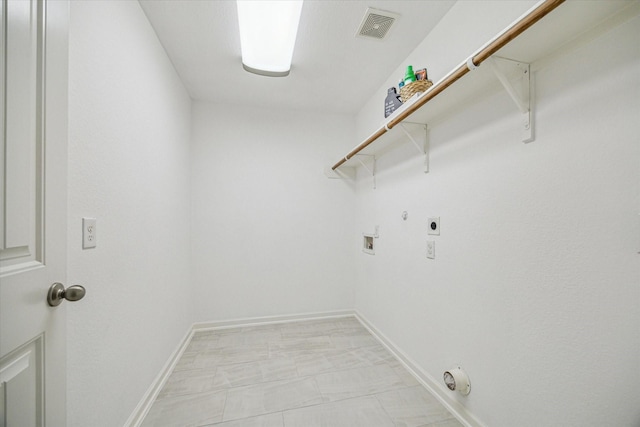 clothes washing area with hookup for a washing machine, gas dryer hookup, and hookup for an electric dryer