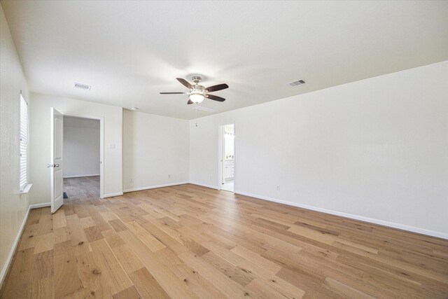 unfurnished room featuring light hardwood / wood-style floors and ceiling fan