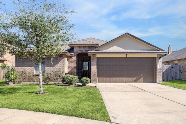 ranch-style home featuring a garage and a front lawn