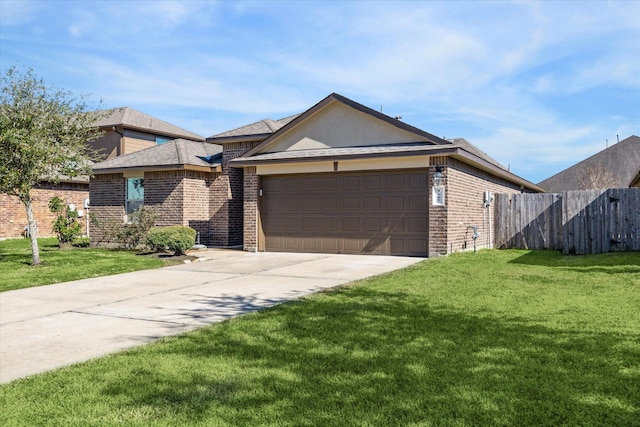 view of front of property with a garage and a front yard