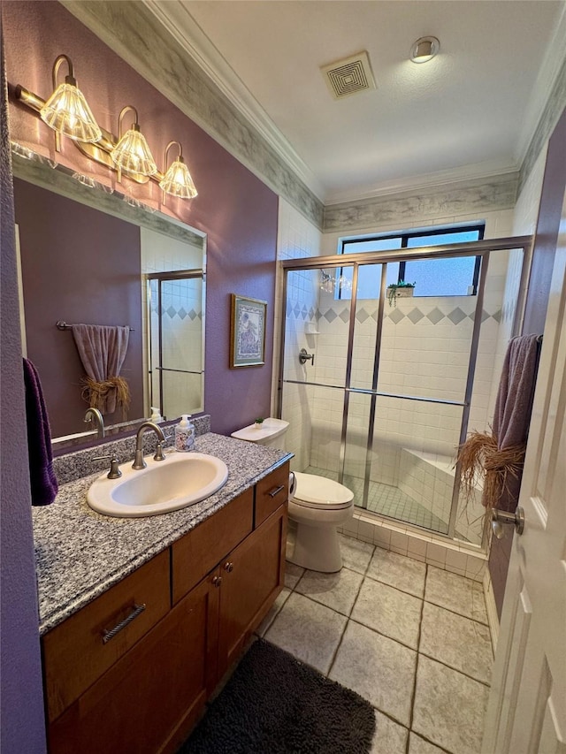 bathroom featuring tile patterned flooring, vanity, an enclosed shower, toilet, and crown molding