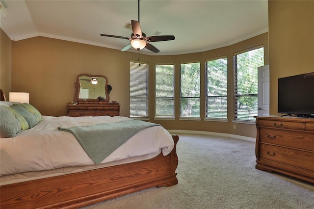 bedroom with multiple windows, crown molding, light colored carpet, and ceiling fan