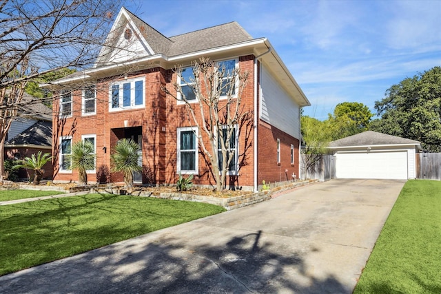 view of front facade featuring a garage and a front yard