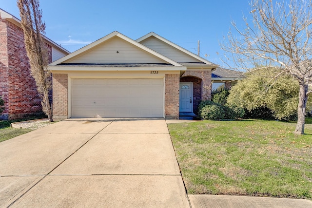 view of front of property with a garage and a front yard