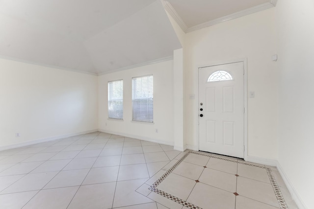 tiled entryway with vaulted ceiling and ornamental molding