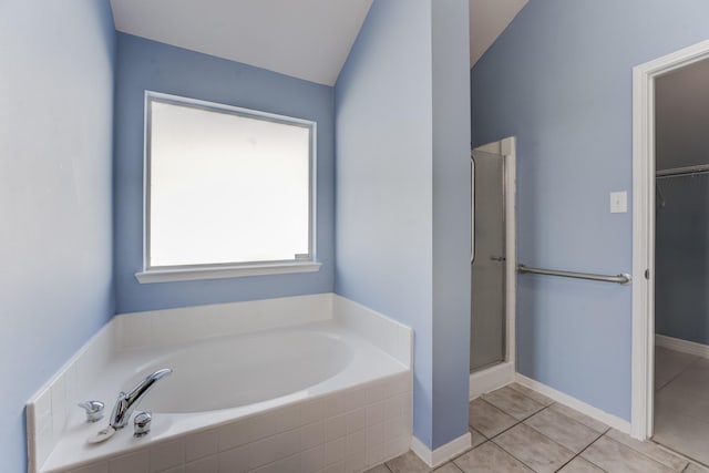 bathroom featuring plus walk in shower and tile patterned floors