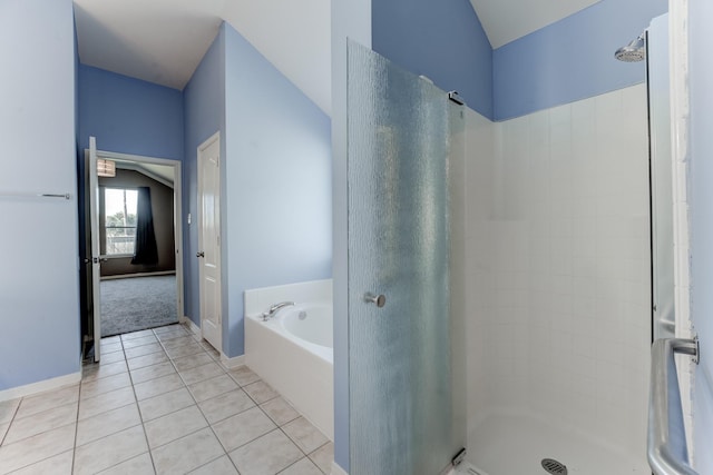 bathroom with tile patterned floors and separate shower and tub